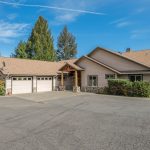 Panoramic view of the luxurious 1030 N Pinnon Rd property, highlighting its lush 5-acre landscape, elegant interior features, and extensive outdoor amenities in Grants Pass, OR.