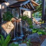 Redwood Hyperion Suites exterior surrounded by lush gardens in Grants Pass, Oregon.